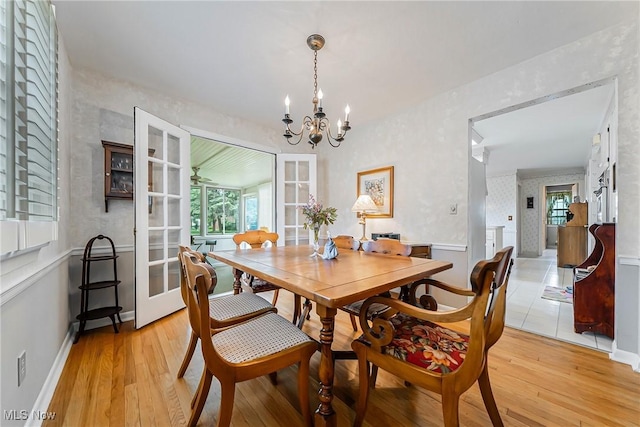 20110 Carolyn Ave, Rocky River, OH 44116 - dining room with a chandelier, light wood-style flooring, and plenty of natural light