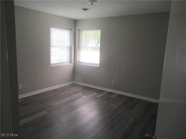 6453 Poplar Dr, Independence, OH 44131 - spare room featuring dark wood-style flooring and baseboards