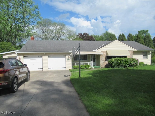 6453 Poplar Dr, Independence, OH 44131 - ranch-style home with a garage, concrete driveway, a front lawn, and a chimney