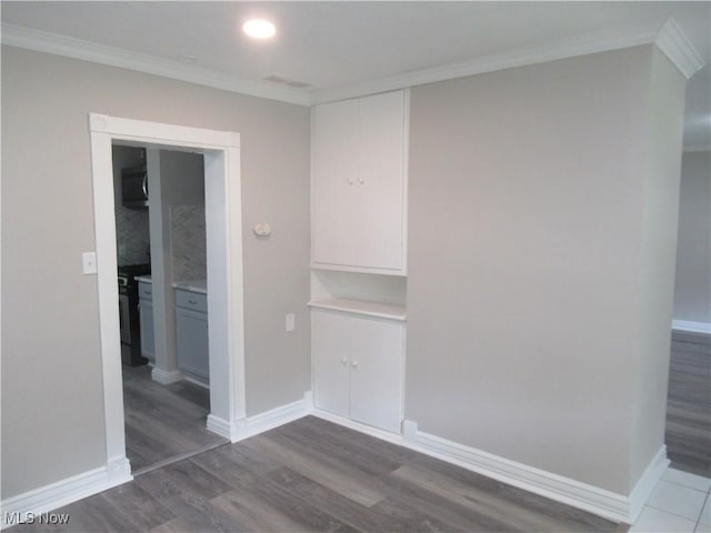 6453 Poplar Dr, Independence, OH 44131 - unfurnished bedroom with ornamental molding, wood finished floors, and baseboards