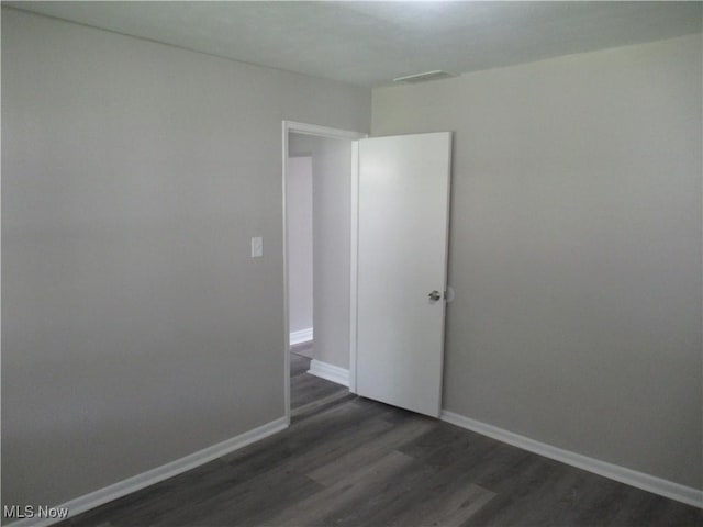 6453 Poplar Dr, Independence, OH 44131 - unfurnished room featuring dark wood-type flooring and baseboards