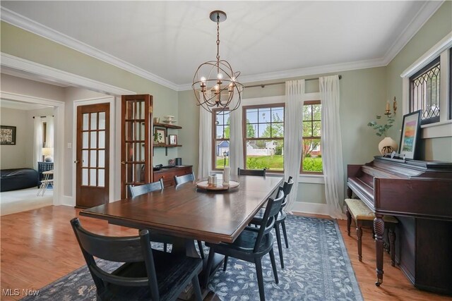 70 Samaritan Ave, Ashland, OH 44805 - dining room with a chandelier, ornamental molding, wood finished floors, and baseboards
