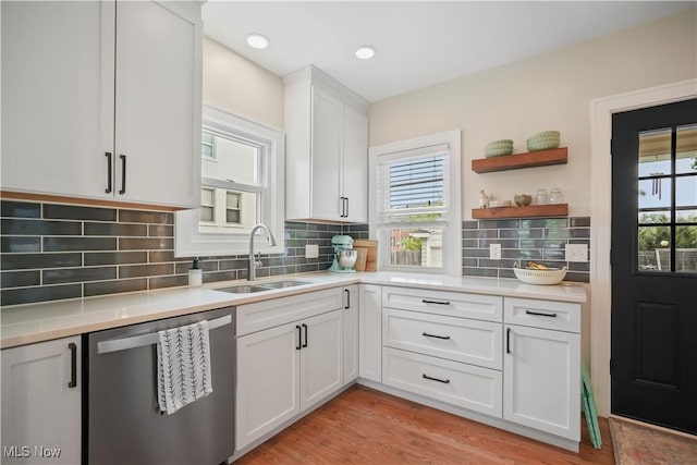 70 Samaritan Ave, Ashland, OH 44805 - kitchen with dishwasher, a sink, light countertops, and white cabinetry