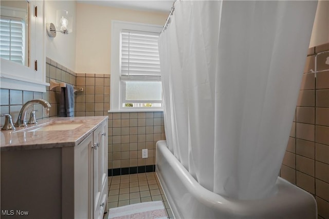 70 Samaritan Ave, Ashland, OH 44805 - full bathroom with tile walls, vanity, tile patterned floors, shower / tub combo with curtain, and wainscoting