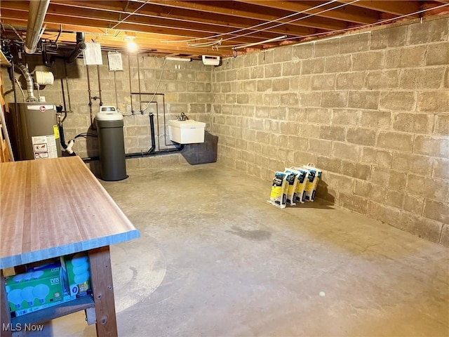 305 Flintwood Dr, Marietta, OH 45750 - unfinished below grade area featuring water heater, a sink, and a water softener