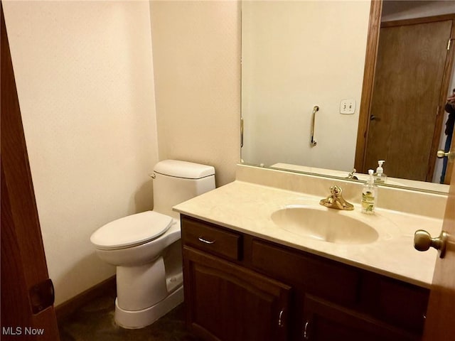 305 Flintwood Dr, Marietta, OH 45750 - bathroom featuring vanity, toilet, and baseboards
