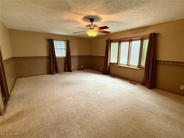305 Flintwood Dr, Marietta, OH 45750 - unfurnished room featuring a textured ceiling, ceiling fan, and light colored carpet