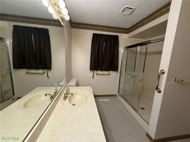305 Flintwood Dr, Marietta, OH 45750 - bathroom featuring a textured ceiling, vanity, a stall shower, baseboards, and ornamental molding
