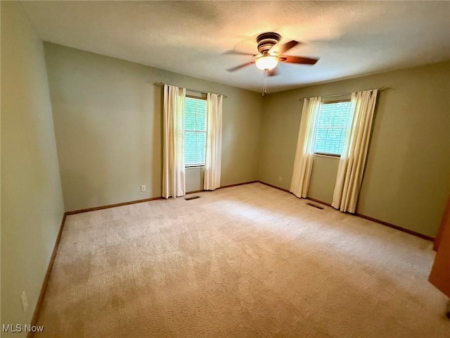 305 Flintwood Dr, Marietta, OH 45750 - unfurnished room featuring healthy amount of natural light, light colored carpet, and baseboards