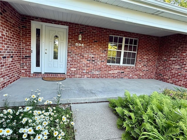 305 Flintwood Dr, Marietta, OH 45750 - doorway to property featuring brick siding and a porch