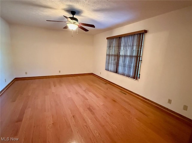 305 Flintwood Dr, Marietta, OH 45750 - empty room with a ceiling fan, light wood-style floors, and baseboards