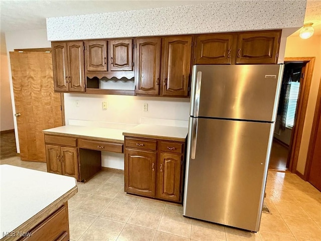 305 Flintwood Dr, Marietta, OH 45750 - kitchen with freestanding refrigerator, light tile patterned floors, light countertops, and open shelves