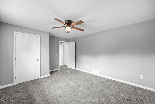 23595 Sandy Creek Rd, Minerva, OH 44657 - unfurnished bedroom featuring baseboards, carpet floors, and ceiling fan