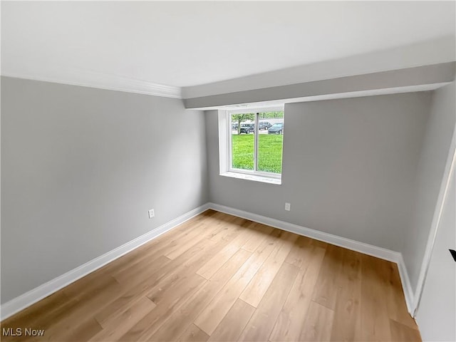9530 Cove Dr Unit C-26, North Royalton, OH 44133 - empty room with baseboards, light wood-type flooring, and crown molding