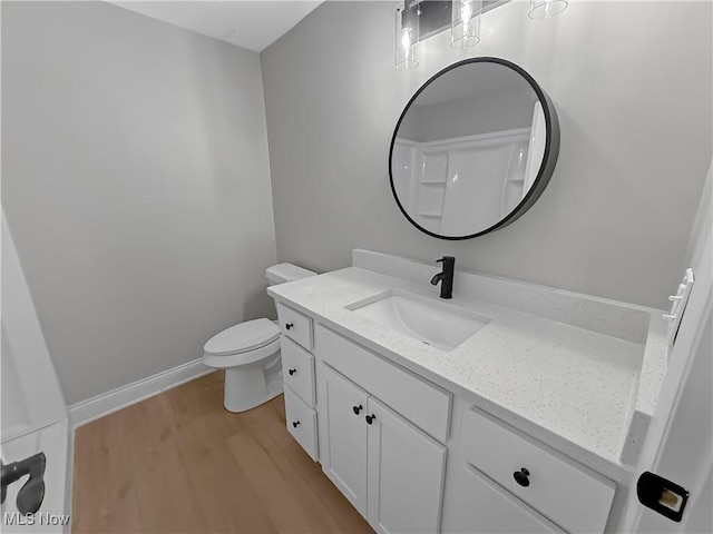 9530 Cove Dr Unit C-26, North Royalton, OH 44133 - bathroom with vanity, toilet, wood finished floors, and baseboards