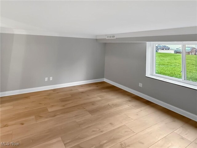 9530 Cove Dr Unit C-26, North Royalton, OH 44133 - empty room with light wood-style flooring, crown molding, and baseboards