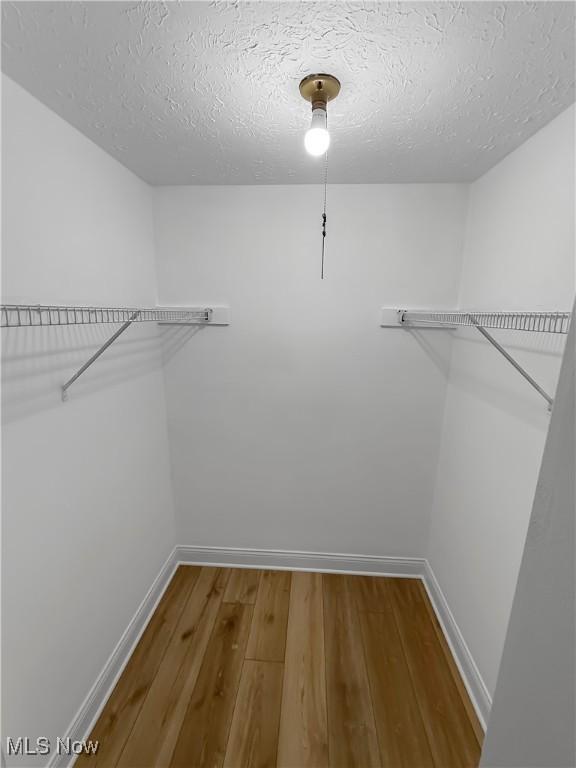 9530 Cove Dr Unit C-26, North Royalton, OH 44133 - spacious closet featuring wood finished floors