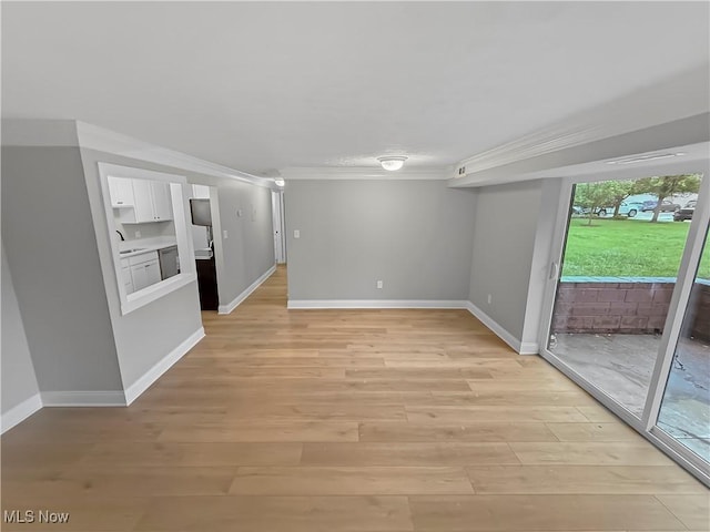 9530 Cove Dr Unit C-26, North Royalton, OH 44133 - empty room featuring crown molding, baseboards, and light wood-style floors