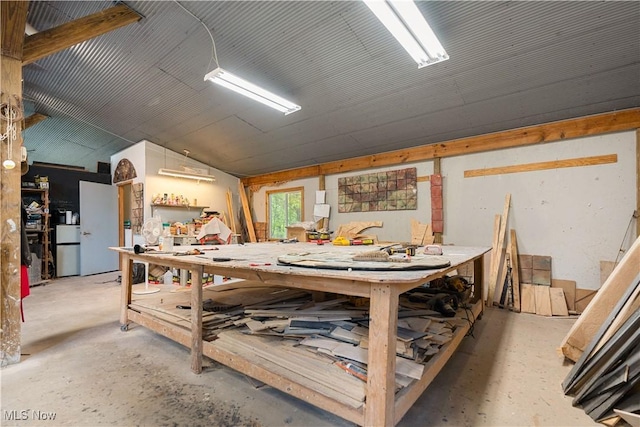15216 Grove Rd SE, Port Washington, OH 43837 - miscellaneous room featuring a workshop area, concrete floors, and lofted ceiling