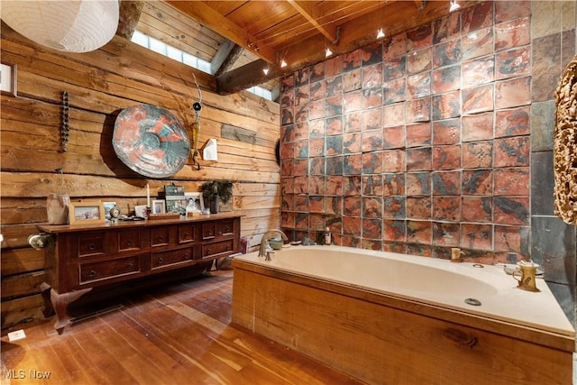 15216 Grove Rd SE, Port Washington, OH 43837 - full bathroom with vanity, a bath, hardwood / wood-style flooring, wooden ceiling with exposed beams, and wood walls