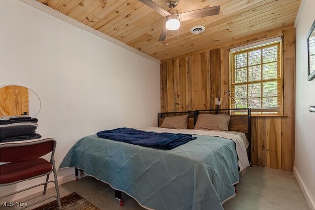 15216 Grove Rd SE, Port Washington, OH 43837 - bedroom with wood walls, wooden ceiling, and carpet flooring