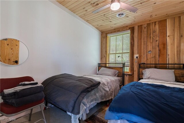 15216 Grove Rd SE, Port Washington, OH 43837 - bedroom featuring wood ceiling, wooden walls, and ceiling fan