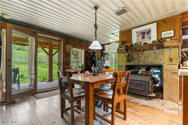 15216 Grove Rd SE, Port Washington, OH 43837 - dining space with wood walls and hardwood / wood-style flooring