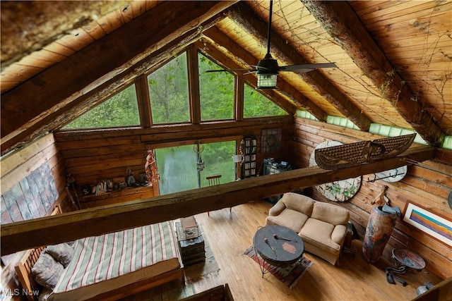15216 Grove Rd SE, Port Washington, OH 43837 - living area featuring wooden ceiling with exposed beams, wood-type flooring, wooden walls, a ceiling fan, and high vaulted ceiling