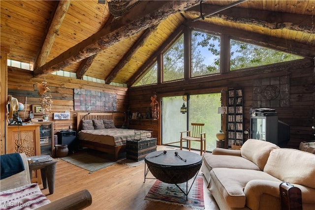 15216 Grove Rd SE, Port Washington, OH 43837 - bedroom featuring wood ceiling with exposed beams, high vaulted ceiling, wood walls, and hardwood / wood-style flooring