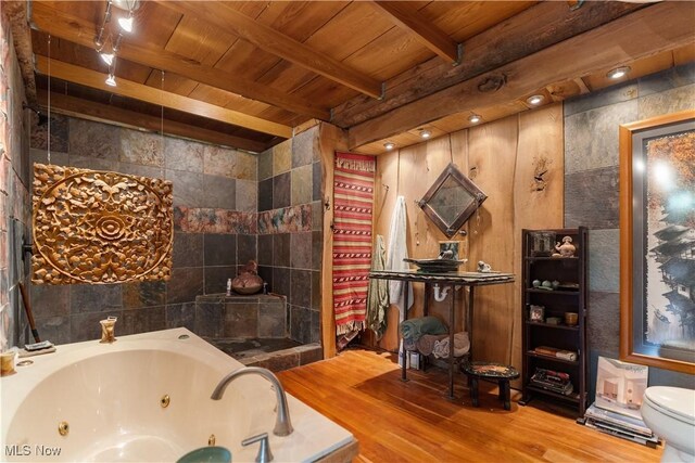 15216 Grove Rd SE, Port Washington, OH 43837 - bathroom featuring wood ceiling with exposed beams, a whirlpool tub, wood finished floors, and toilet