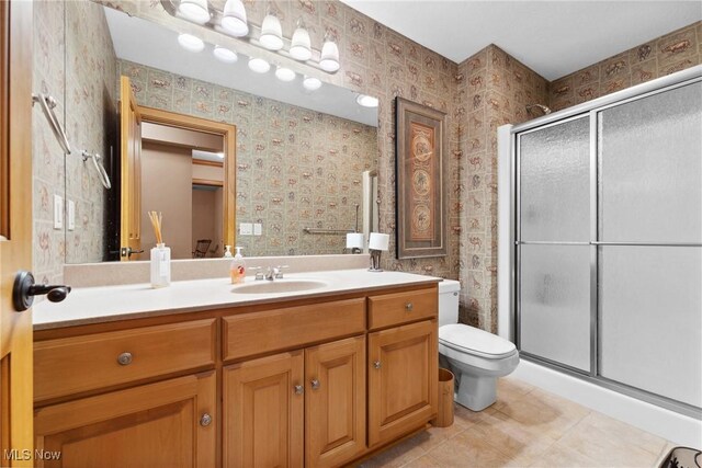 3109 Kennesaw Cir NW, Canton, OH 44708 - full bath featuring a shower stall, toilet, vanity, and wallpapered walls