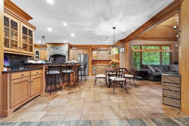3109 Kennesaw Cir NW, Canton, OH 44708 - kitchen featuring stainless steel fridge with ice dispenser, stone tile floors, decorative backsplash, recessed lighting, and a kitchen bar