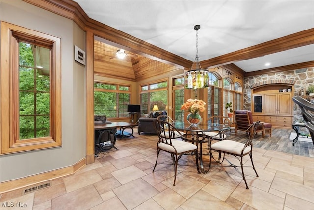 3109 Kennesaw Cir NW, Canton, OH 44708 - dining room with plenty of natural light, baseboards, light stone finish floors, and beam ceiling