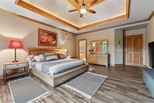3109 Kennesaw Cir NW, Canton, OH 44708 - bedroom featuring a tray ceiling, ornamental molding, baseboards, and wood finished floors