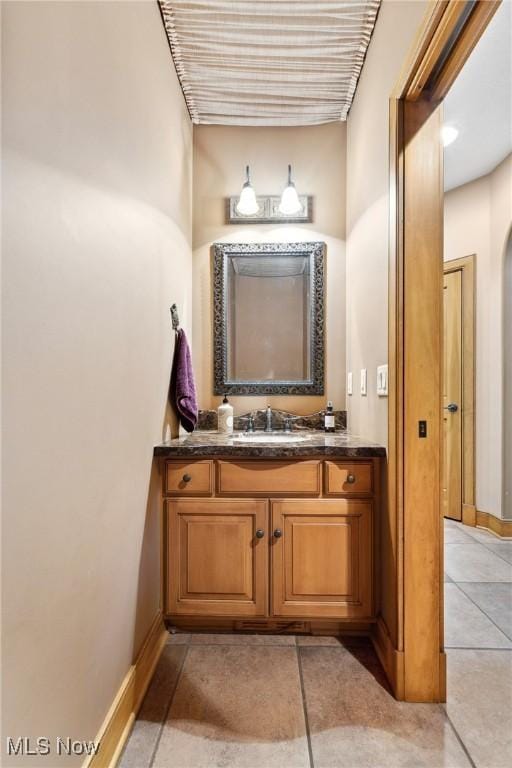 3109 Kennesaw Cir NW, Canton, OH 44708 - bathroom featuring vanity, tile patterned flooring, and baseboards