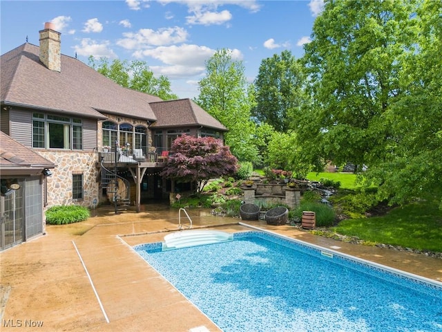 3109 Kennesaw Cir NW, Canton, OH 44708 - swimming pool with stairway, a patio area, and a wooden deck