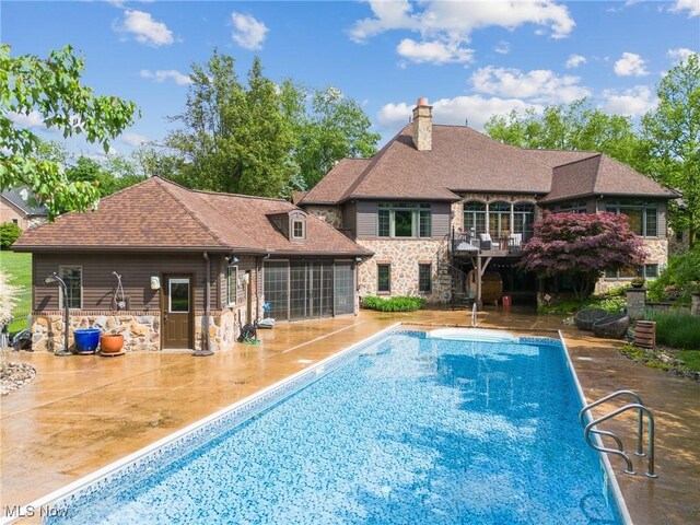 3109 Kennesaw Cir NW, Canton, OH 44708 - outdoor pool with a patio area, a sunroom, and stairway