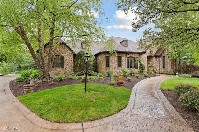 3109 Kennesaw Cir NW, Canton, OH 44708 - view of front facade with stone siding and a front yard