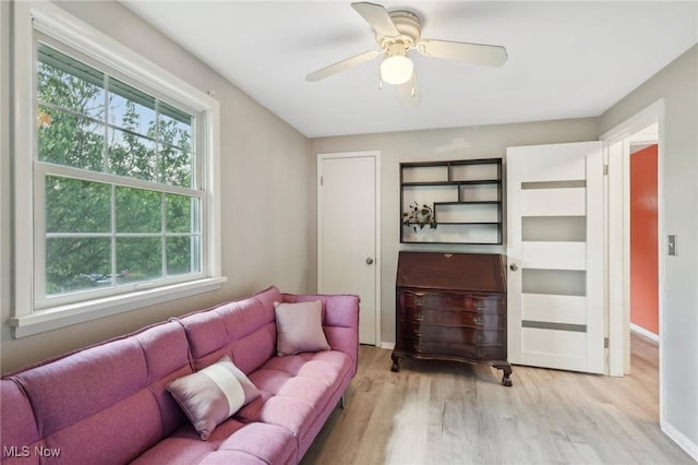 179 High St, Chagrin Falls, OH 44022 - living area with healthy amount of natural light, wood finished floors, a ceiling fan, and baseboards
