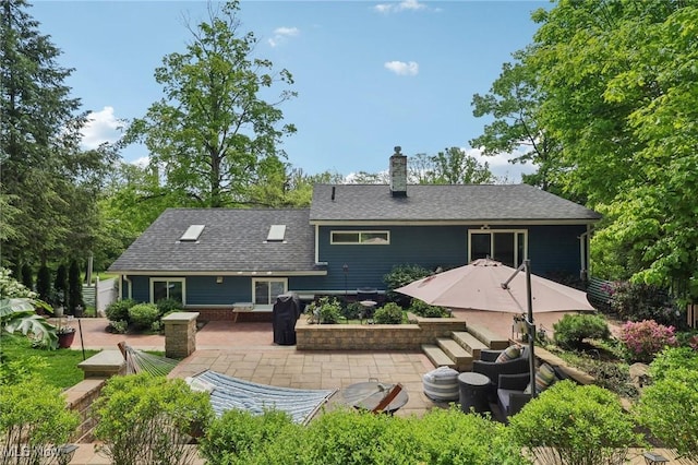 179 High St, Chagrin Falls, OH 44022 - back of house featuring a patio, a chimney, and roof with shingles