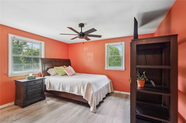 179 High St, Chagrin Falls, OH 44022 - bedroom featuring multiple windows, light wood-style floors, and baseboards