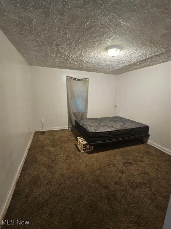 72 Idaho Rd, Austintown, OH 44515 - carpeted bedroom with a textured ceiling and baseboards