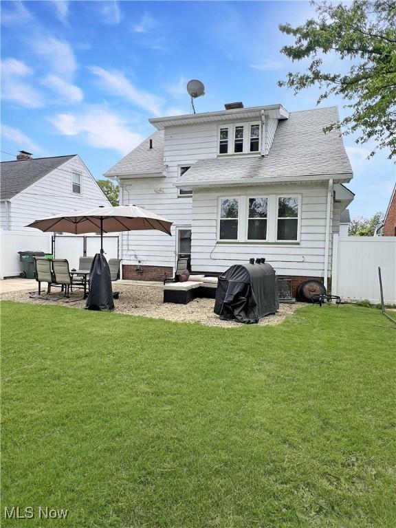 9007 Plymouth Ave, Garfield Heights, OH 44125 - back of house with roof with shingles and a patio area