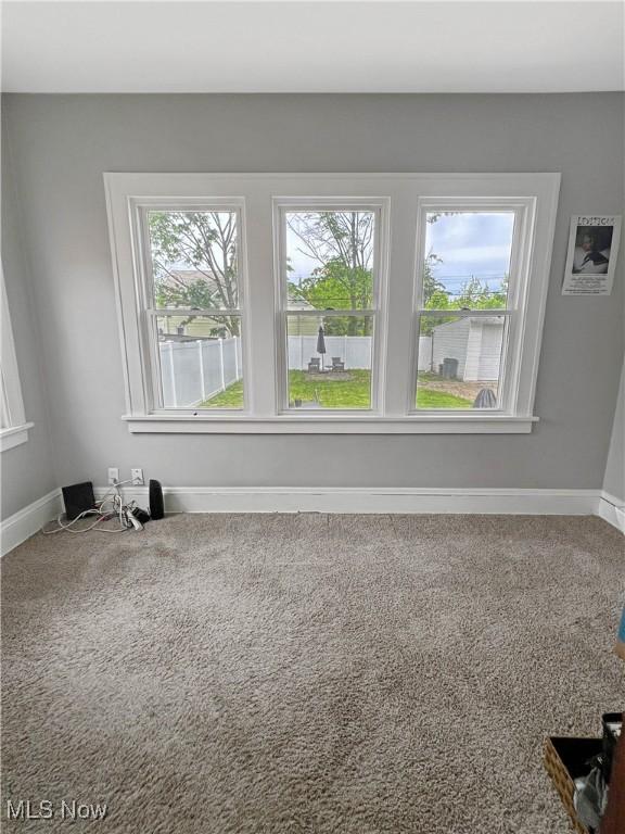 9007 Plymouth Ave, Garfield Heights, OH 44125 - carpeted empty room featuring baseboards