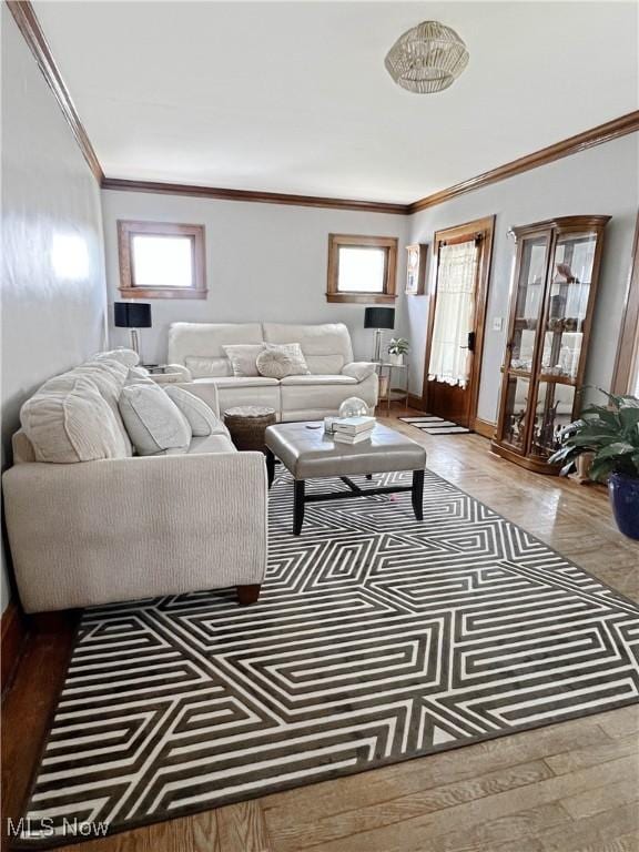 9007 Plymouth Ave, Garfield Heights, OH 44125 - living area with crown molding, baseboards, and wood finished floors