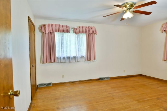3763 E River Rd, Newton Falls, OH 44444 - unfurnished room featuring light wood-style floors, a ceiling fan, and baseboards
