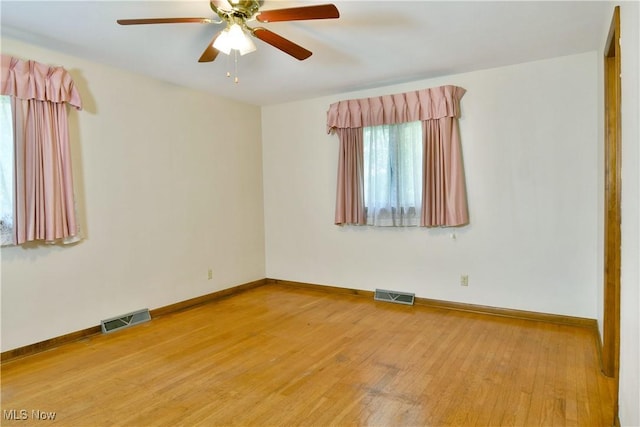 3763 E River Rd, Newton Falls, OH 44444 - unfurnished room featuring light wood-style flooring, baseboards, and a ceiling fan