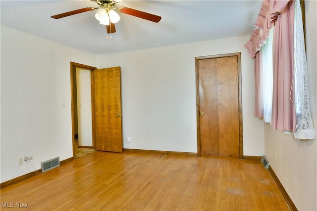 3763 E River Rd, Newton Falls, OH 44444 - unfurnished bedroom featuring wood finished floors, baseboards, and a ceiling fan