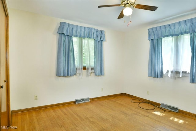3763 E River Rd, Newton Falls, OH 44444 - spare room with wood finished floors, a ceiling fan, and baseboards