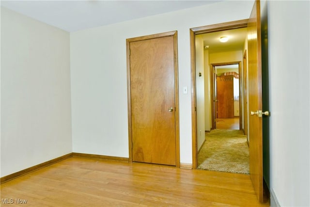 3763 E River Rd, Newton Falls, OH 44444 - unfurnished bedroom with light wood-type flooring and baseboards